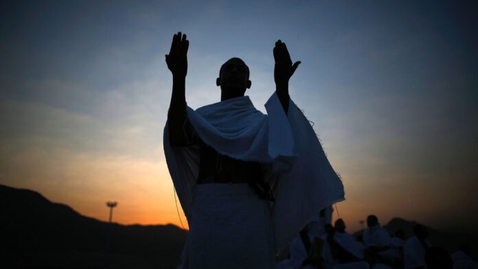 A man praying during his holy places Umrah trip